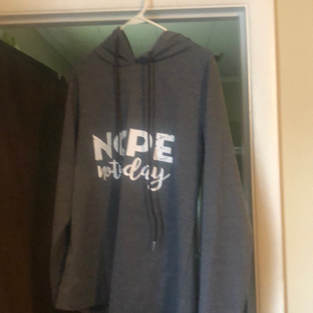 Never worn gray sweatshirt with hood. Great condition. Non smoking home